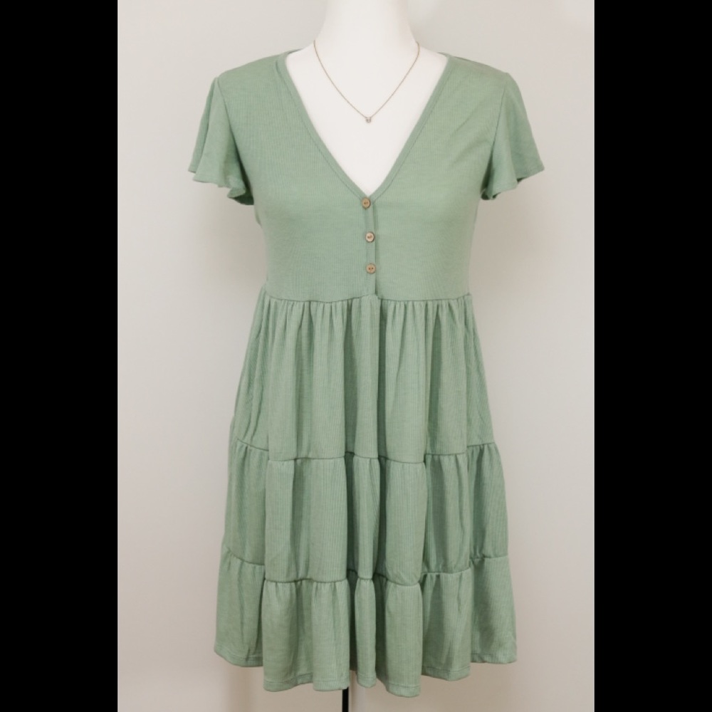3-tier dress in soft green.